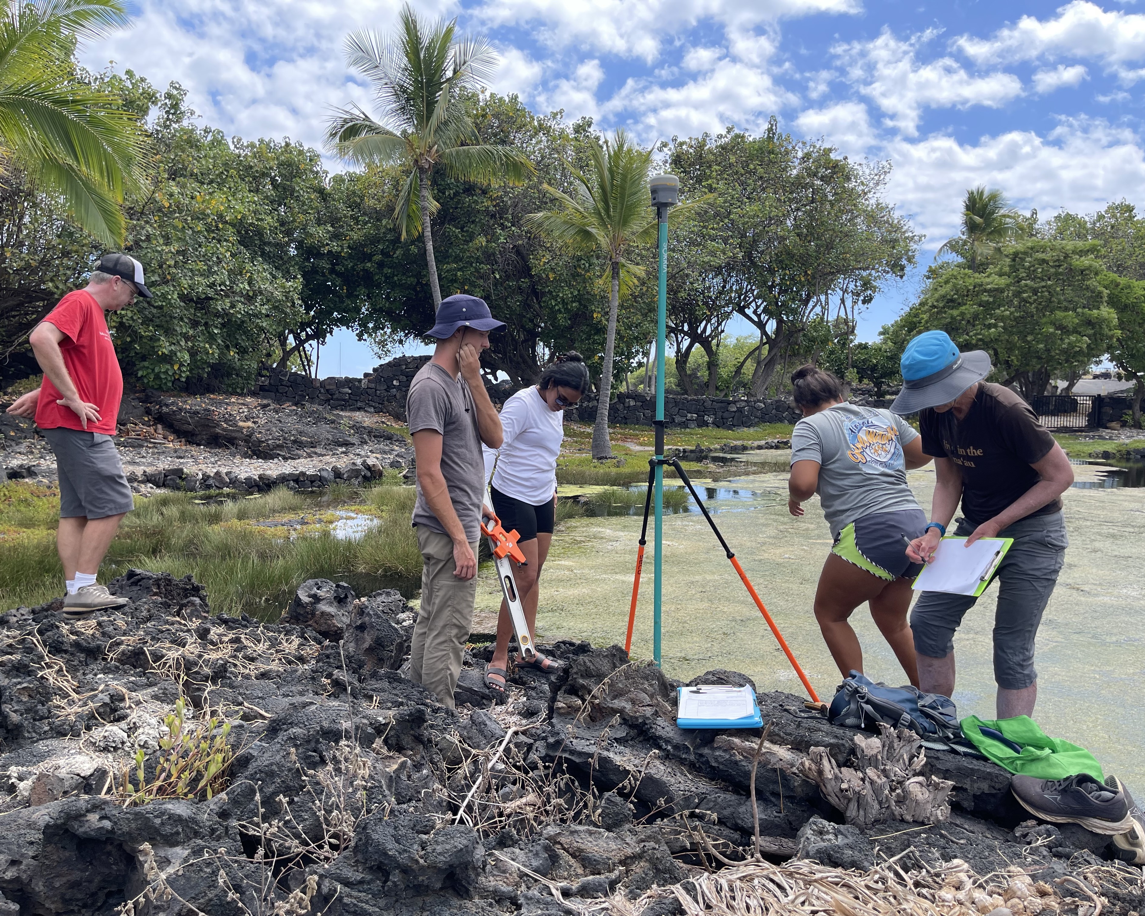 Students and Faculty with equipment taking measurements on the Hawaiʻi coast