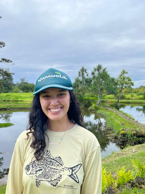 Headshot of Cienna Lei smiling with Kumuola fishpond in the background