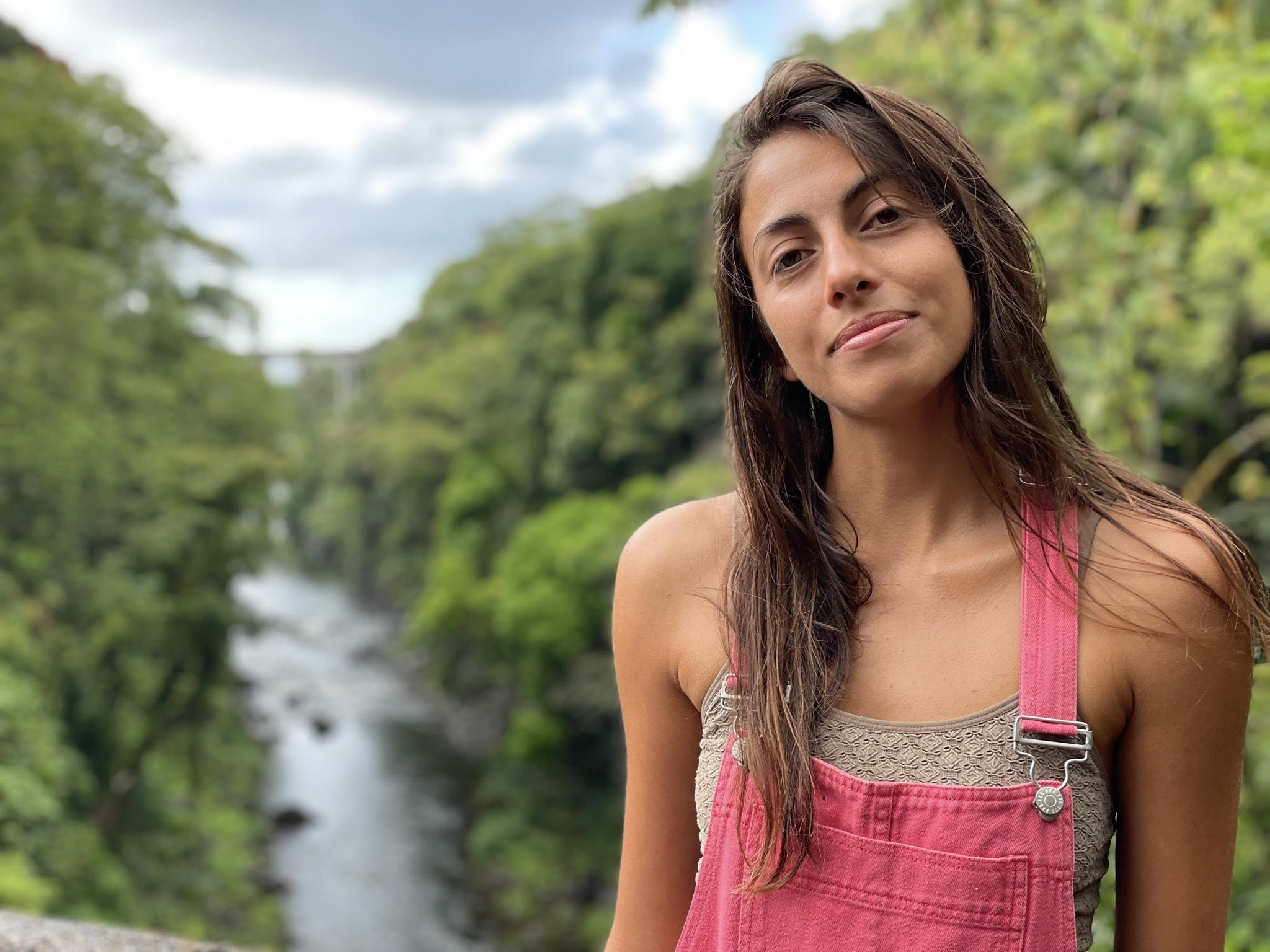 Headshot of Rebecca with a waterfall in the background