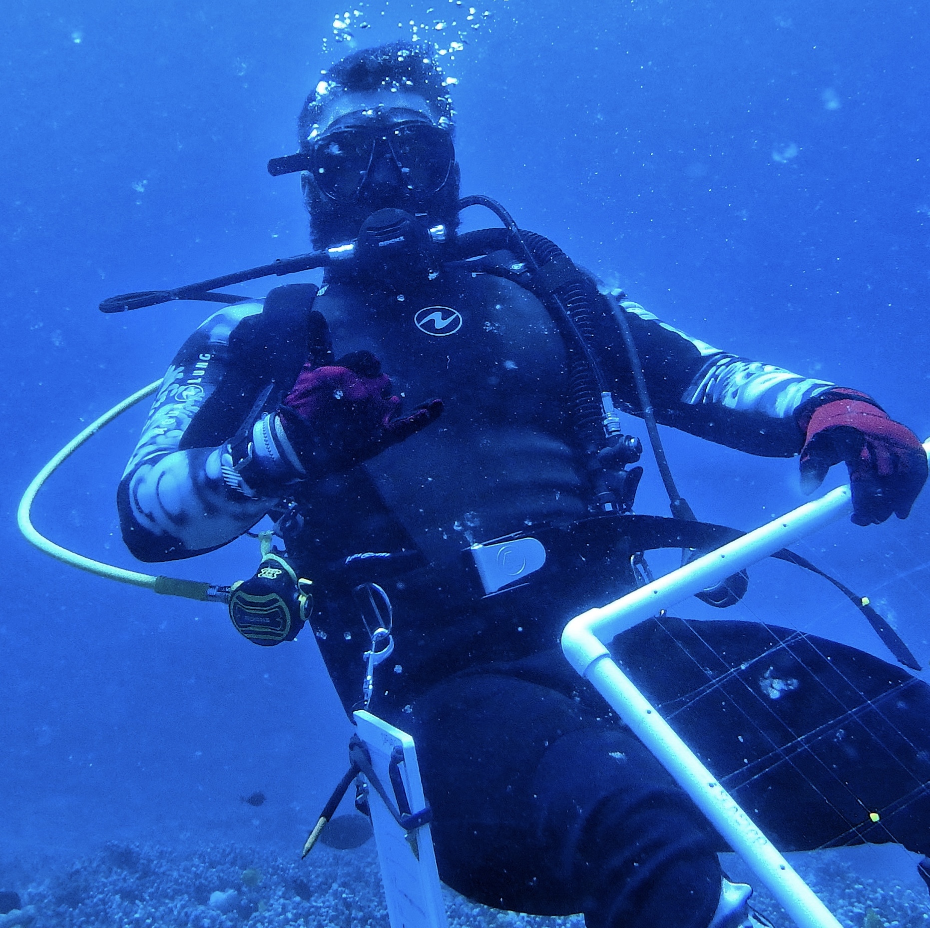 Headshot of Trevor underwater in dive gear